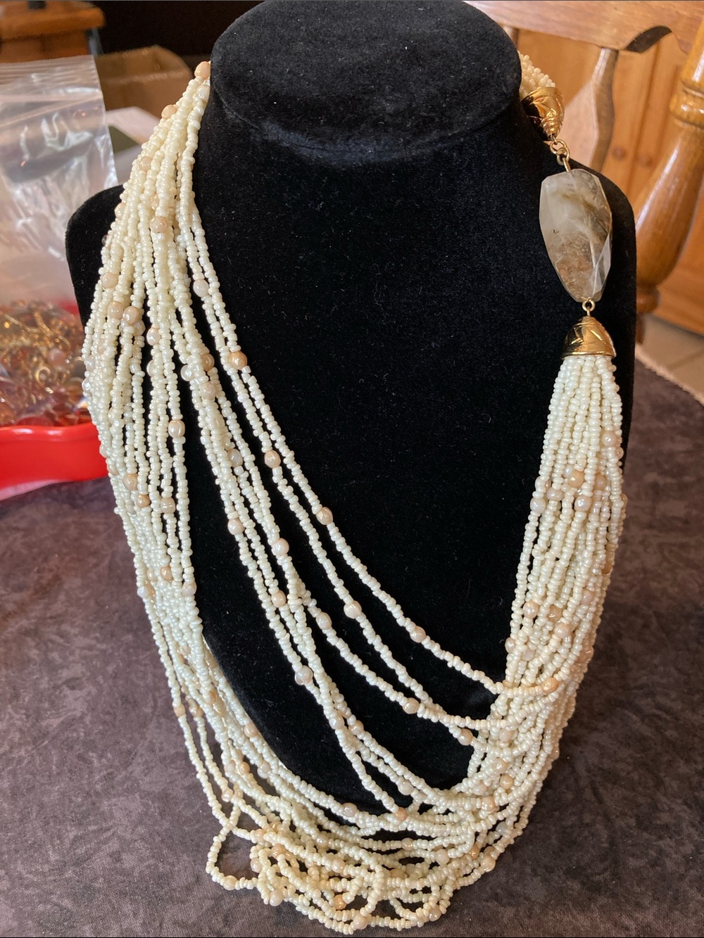 Multi-Strand Cream Bead Necklace with Translucent Gold/Clear Accent